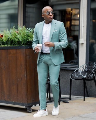 Mint Suit Outfits: Consider pairing a mint suit with a white crew-neck t-shirt for casual refinement with a masculine finish. If you wish to immediately tone down this outfit with shoes, why not complete this outfit with white canvas low top sneakers?
