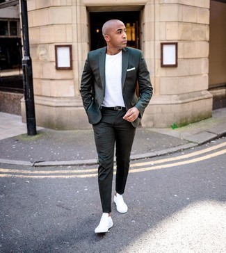 Dark Green Suit Outfits: Teaming a dark green suit and a white crew-neck t-shirt will prove your prowess in men's fashion. When this ensemble looks all-too-dressy, tone it down by rocking a pair of white canvas low top sneakers.