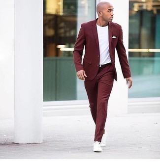 Red Suit Outfits: You'll be surprised at how easy it is for any gentleman to pull together this effortlessly sleek ensemble. Just a red suit paired with a white crew-neck t-shirt. Rounding off with a pair of white canvas low top sneakers is an effective way to bring a dash of stylish nonchalance to this ensemble.