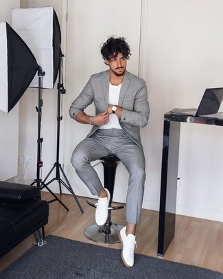 Grey Suit with Low Top Sneakers Outfits: When the situation calls for a polished yet knockout getup, you can always rely on a grey suit and a white crew-neck t-shirt. If you wish to instantly dial down your outfit with one single item, complement your ensemble with a pair of low top sneakers.