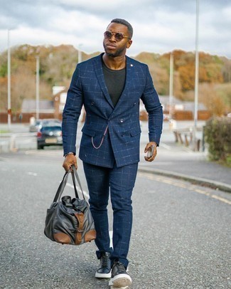 Charcoal Canvas Duffle Bag Outfits For Men: Dress in a navy check suit and a charcoal canvas duffle bag for a hassle-free getup that's also well put together. This ensemble is finished off perfectly with a pair of black and white leather low top sneakers.