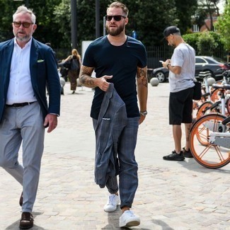 Blue Plaid Suit Outfits: A blue plaid suit and a navy crew-neck t-shirt are totally worth adding to your list of veritable menswear essentials. Go off the beaten path and spice up your look by slipping into a pair of white canvas low top sneakers.