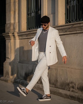 White Suit Outfits: This combination of a white suit and a black and white horizontal striped crew-neck t-shirt looks considered and immediately makes you look cool. Add a more casual twist to by slipping into black and white canvas low top sneakers.