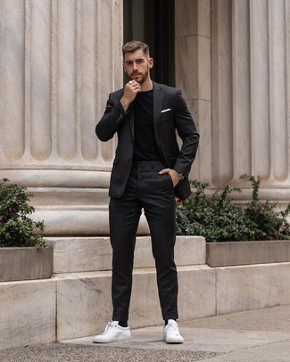 Black Check Suit Outfits: This combo of a black check suit and a black crew-neck t-shirt is undeniable proof that a safe look doesn't have to be boring. For something more on the relaxed end to round off your getup, opt for white canvas low top sneakers.