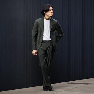 Dark Green Suit Outfits: A smart pairing of a dark green suit and a white crew-neck t-shirt is appropriate in a ton of circumstances. And if you wish to instantly up the ante of this outfit with one item, why not add black suede tassel loafers to the equation?