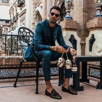 Teal Suit Outfits: Go for a teal suit and a navy crew-neck t-shirt if you're going for a crisp, stylish outfit. Dark brown leather tassel loafers will take your getup down a dressier path.