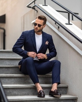 Dark Brown Leather Tassel Loafers Outfits: No matter where you go over the course of the day, you'll feel completely confident in yourself in a navy suit and a white crew-neck t-shirt. Add dark brown leather tassel loafers to the equation for an instant style lift.