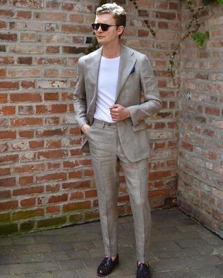 Grey Suit Hot Weather Outfits: A grey suit and a white crew-neck t-shirt paired together are the ideal getup for men who love polished ensembles. And if you need to easily perk up your ensemble with shoes, complement this look with a pair of dark brown leather tassel loafers.