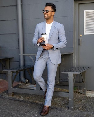 Light Blue Suit Outfits: For an effortlessly stylish look, wear a light blue suit and a white crew-neck t-shirt — these two items go really well together. Kick up the classiness of your outfit a bit by sporting dark brown leather tassel loafers.