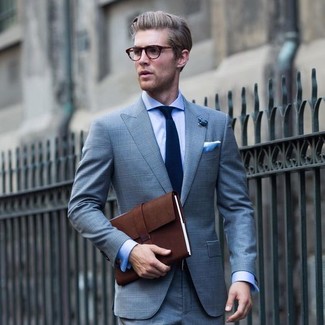 Brown Leather Briefcase Outfits: For an off-duty outfit, dress in a light blue plaid suit and a brown leather briefcase — these two items work perfectly well together.