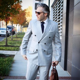 Tobacco Leather Briefcase Outfits: Look seriously stylish yet relaxed in a grey suit and a tobacco leather briefcase.