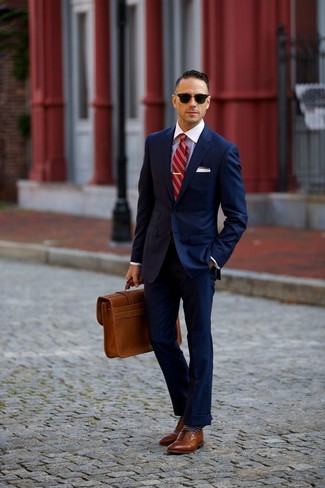 Tobacco Leather Briefcase Outfits: A navy suit and a tobacco leather briefcase are wonderful menswear staples that will integrate perfectly within your casual collection. Add a pair of brown leather brogues to this getup to effortlessly boost the classy factor of this outfit.