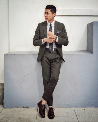 Dark Green Suit Outfits: Wear a dark green suit with a white check dress shirt for a sleek polished outfit. Want to go easy with footwear? Complete this ensemble with a pair of dark brown leather brogues for the day.