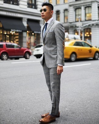 Blue Horizontal Striped Socks Outfits For Men: Nail the casually stylish outfit by opting for a grey plaid suit and blue horizontal striped socks. Here's how to smarten up this look: brown leather brogues.