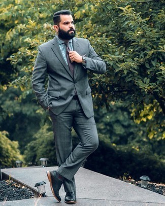 Dark Brown Tie Outfits For Men: This combination of a grey plaid suit and a dark brown tie is a goofproof option when you need to look classy and truly sharp. Go ahead and add black leather brogues to the equation for a dose of stylish nonchalance.