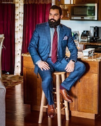 Brown Leather Brogues Outfits: Go for a navy plaid suit and a white and navy gingham dress shirt and you're guaranteed to make ladies go weak in the knees. Brown leather brogues will be a stylish companion to your look.