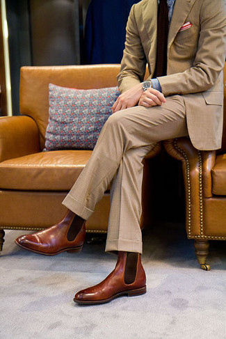 Channel your inner Kingsman agent and pair a tan suit with a blue gingham dress shirt. Rounding off with a pair of brown leather chelsea boots is a surefire way to introduce an air of stylish casualness to your getup.