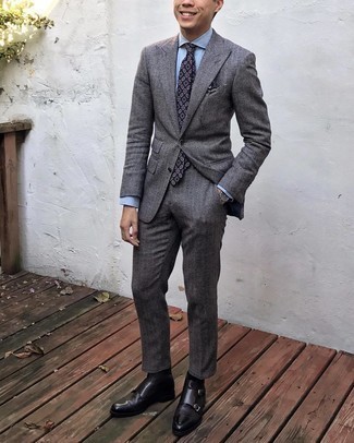 Charcoal Herringbone Wool Suit Outfits: Try teaming a charcoal herringbone wool suit with a light blue dress shirt and you'll be the picture of refined men's fashion. To give your overall outfit a more laid-back vibe, complement your look with dark brown leather chelsea boots.