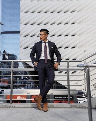 Purple Polka Dot Tie Outfits For Men: A navy vertical striped suit and a purple polka dot tie are absolute essentials if you're picking out a smart wardrobe that matches up to the highest sartorial standards. Feel uninspired with this ensemble? Let a pair of brown suede chelsea boots spice things up.