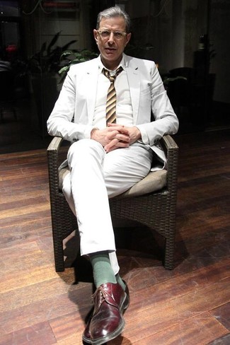 Jeff Goldblum wearing White Suit, White Dress Shirt, Burgundy Leather Derby Shoes, Yellow Vertical Striped Tie