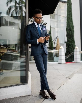 Navy Plaid Suit Outfits: Go all out in a navy plaid suit and a white dress shirt. Let your outfit coordination sensibilities really shine by finishing off this outfit with dark brown leather derby shoes.