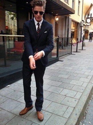 Brown Derby Shoes Outfits: You'll be surprised at how easy it is to throw together this refined ensemble. Just a navy vertical striped suit and a white dress shirt. This getup is finished off wonderfully with brown derby shoes.