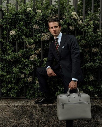 Grey Leather Briefcase Outfits: Fashionable and comfortable, this off-duty combination of a black vertical striped suit and a grey leather briefcase provides with amazing styling opportunities. Unimpressed with this look? Introduce black leather derby shoes to switch things up.