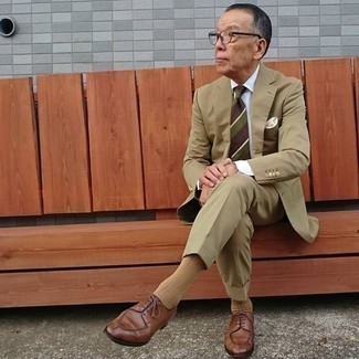 Brown Horizontal Striped Tie Outfits For Men: Loving how this combination of a tan suit and a brown horizontal striped tie instantly makes any man look refined and dapper. Add brown leather derby shoes to this look to effortlessly amp up the fashion factor of your ensemble.