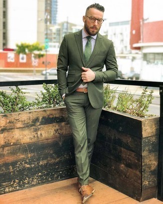 Olive Suit Outfits: Pairing an olive suit and a white vertical striped dress shirt will prove your sartorial savvy. When it comes to shoes, introduce tan leather derby shoes to the equation.