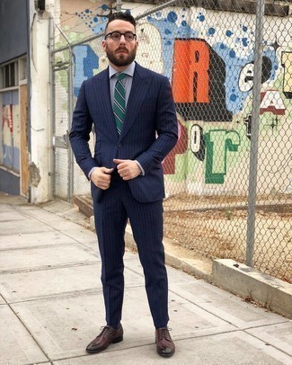 Dark Green Horizontal Striped Tie Outfits For Men: For a look that's polished and gasp-worthy, wear a navy vertical striped suit and a dark green horizontal striped tie. To add a more casual aesthetic to your outfit, add a pair of burgundy leather derby shoes to the equation.