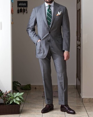 Dark Green Horizontal Striped Tie Outfits For Men: This classy combination of a grey suit and a dark green horizontal striped tie will be a true testimony to your outfit coordination prowess. For something more on the relaxed end to complete your look, introduce a pair of burgundy leather derby shoes to this look.