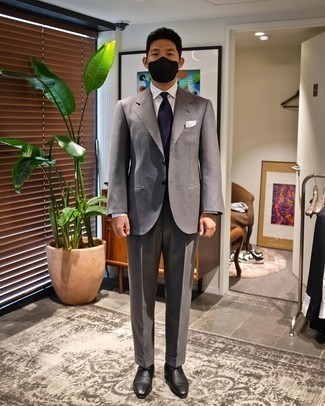 Navy Tie Outfits For Men: Teaming a grey suit and a navy tie is a guaranteed way to infuse your daily routine with some masculine sophistication. Complement this look with black leather derby shoes to make a dressy look feel suddenly fresh.