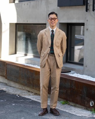 Tan Suit Outfits: This ensemble suggests that it pays to invest in such smart menswear pieces as a tan suit and a white vertical striped dress shirt. A pair of dark brown leather derby shoes can integrate wonderfully within a great deal of combinations.
