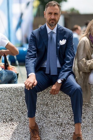 Navy Canvas Watch Outfits For Men: Nail the casually stylish getup by wearing a navy suit and a navy canvas watch. Tap into some David Gandy dapperness and lift up your look with brown leather desert boots.