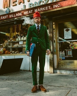 Red Beanie Outfits For Men: A dark green corduroy suit and a red beanie are essential menswear items, without which no wardrobe would be complete. Feeling creative today? Change things up a bit by finishing with a pair of brown suede desert boots.