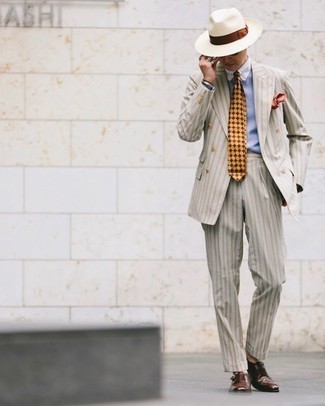 500+ Dressy Outfits For Men: This combination of a beige vertical striped suit and a light blue dress shirt is a foolproof option when you need to look incredibly stylish. Put a relaxed spin on your ensemble with dark brown leather double monks.