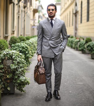 Tobacco Leather Briefcase Outfits: Pair a grey vertical striped suit with a tobacco leather briefcase to pull together a neat and relaxed look. Get a bit experimental when it comes to shoes and dress up your getup by finishing off with black leather double monks.
