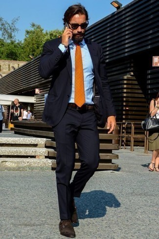 Orange Polka Dot Tie Outfits For Men: This is definitive proof that a navy suit and an orange polka dot tie look amazing paired together in an elegant look for today's guy. A pair of dark brown suede double monks adds a new depth to an otherwise traditional outfit.