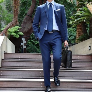 Briefcase Outfits: This combination of a blue suit and a briefcase is on the casual side but guarantees that you look sharp and seriously sharp. Finishing off with black leather double monks is a surefire way to breathe an air of refinement into this look.