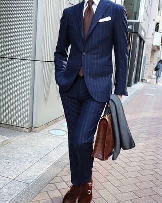 Briefcase Outfits: In situations comfort is critical, consider teaming a navy vertical striped suit with a briefcase. On the fence about how to complete this ensemble? Rock a pair of brown suede double monks to kick it up a notch.