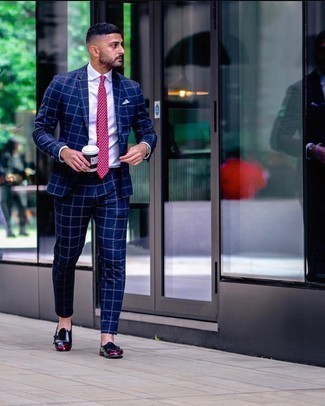 Purple Tie Outfits For Men: Choose a navy check suit and a purple tie for seriously dapper attire. Put a fresh spin on an otherwise standard ensemble by rounding off with a pair of navy leather double monks.