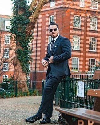 Navy Suit Dressy Warm Weather Outfits: Putting together a navy suit and a white dress shirt will hallmark your outfit coordination prowess. Put a more casual spin on your look with black leather double monks.