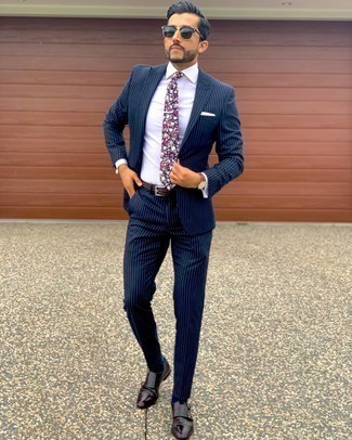 Multi colored Floral Tie Outfits For Men: When it comes to timeless class, this pairing of a navy vertical striped suit and a multi colored floral tie is the ultimate style. Burgundy leather double monks will immediately tone down an all-too-perfect ensemble.