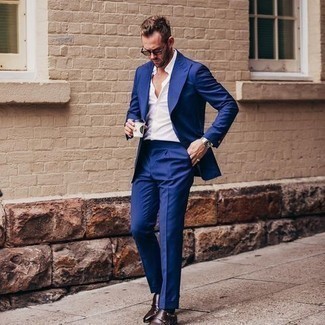 Blue Suit Outfits: Teaming a blue suit and a white dress shirt is a surefire way to inject your wardrobe with some rugged refinement. And if you wish to effortlessly play down this outfit with one single item, why not complement this getup with a pair of dark brown leather double monks?