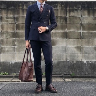 Brown Canvas Watch Outfits For Men: This combination of a navy vertical striped suit and a brown canvas watch is great for off-duty situations. For a more refined aesthetic, introduce a pair of dark brown leather double monks to the equation.