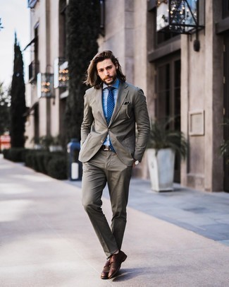 Olive Suit Outfits: Marrying an olive suit and a light blue dress shirt is a surefire way to inject your wardrobe with some masculine sophistication. Feeling brave? Change up your look with a pair of brown leather double monks.