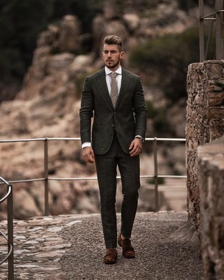 Beige Paisley Tie Outfits For Men: A dark green suit and a beige paisley tie are among the crucial pieces of any gent's wardrobe. Take an otherwise mostly classic outfit in a less formal direction by rounding off with brown suede double monks.