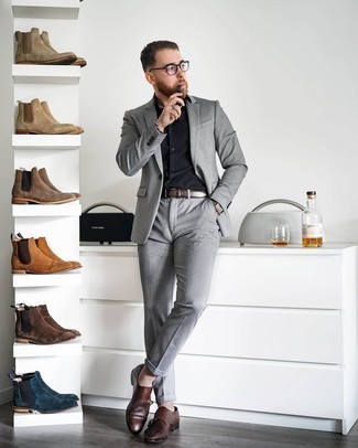 Double Monks Outfits: This combination of a grey suit and a black dress shirt is a solid bet when you need to look elegant and really smart. Go off the beaten path and jazz up your ensemble by sporting a pair of double monks.