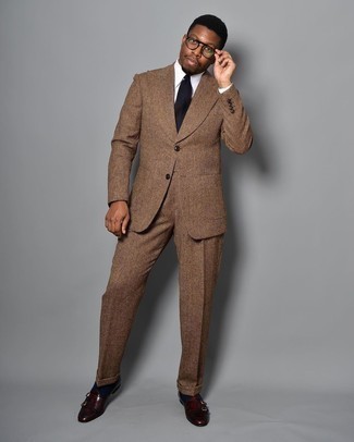 Double Monks Outfits: We love how this combo of a brown wool suit and a white dress shirt immediately makes a man look classy and smart. Make double monks your footwear choice to effortlessly step up the street cred of this ensemble.