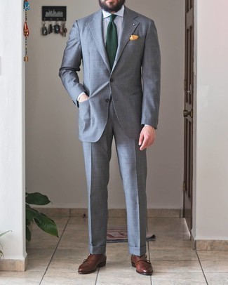 Dark Green Tie Outfits For Men: One of the most elegant ways to style out such a timeless menswear piece as a grey suit is to combine it with a dark green tie. Complete this outfit with a pair of brown leather double monks to inject a touch of stylish casualness into this ensemble.